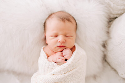 Joplin motherhood and family photographer Jessica Kennedy of The XO Photography captures sleeping newborn in swaddle