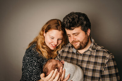 newborn-baby-posed-on-black-background