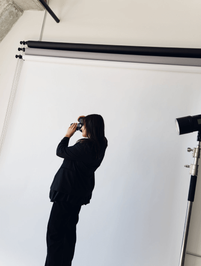 Dani Antony posing with her camera 