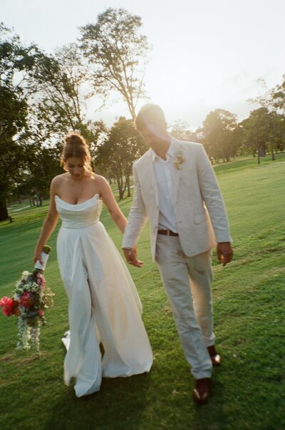 A couple photographed on film saying their vows at the Wynnum Golf Club
