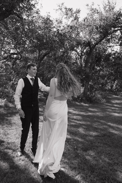 young bridal couple dancing at outdoor Texas wedding 