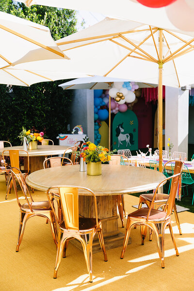 outdoor table with umbrella at child's birthday party