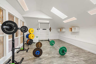 Bright physical therapy room with exercise equipment and open space