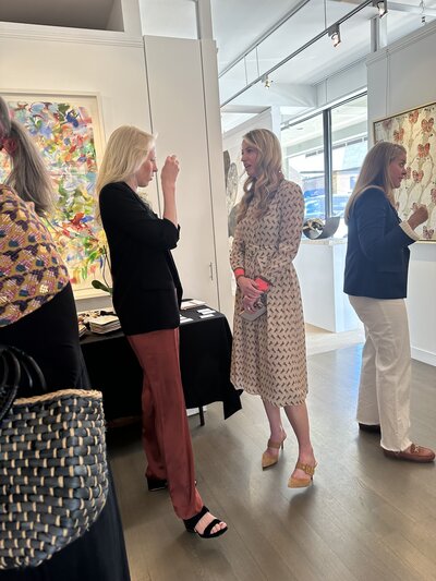 Liz Walton talking to friend at event