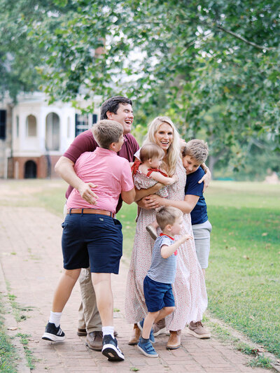 A family hugging at a Richmond mini session by Katie Stansfield Photography.