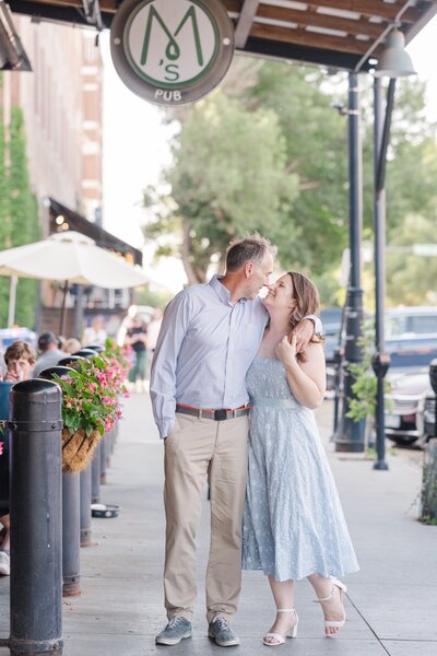 an engaged couple touching noses