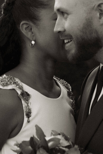 bride and groom sharing whispers in Paris, France
