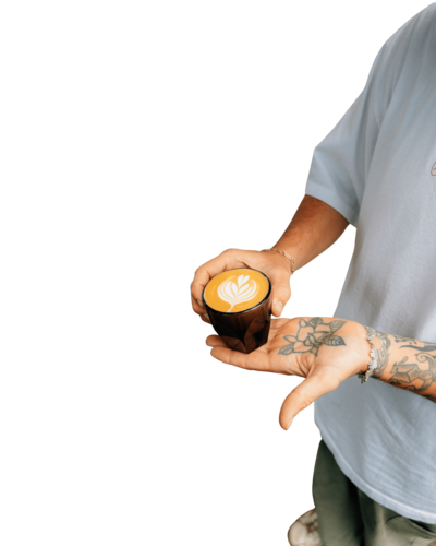 trilogy coffee kauai owner holding coffee beverage 