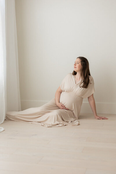 Expecting mom at a newborn photoshoot in Cedar Rapids