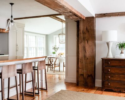 Hingham home over 200 years old, preserving fireplaces, posts, and beams while adding contemporary furnishings and design updates. 