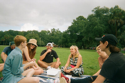 Friends having a picnic at Forsyth Park in Savannah GA