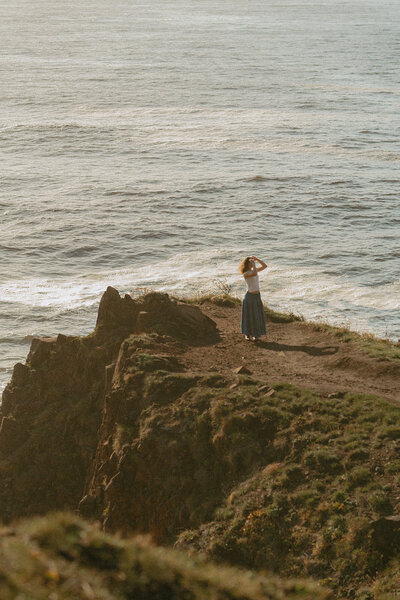 girl sitting with dog at oregon coast