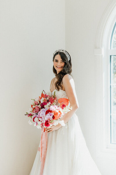 bride holding wedding bouquet example of wedding and event planner work