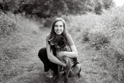 woman hugs dog at seven islands state birding park in kodak tennessee