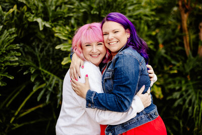 Ashley Ebert smiles looking up from her phone