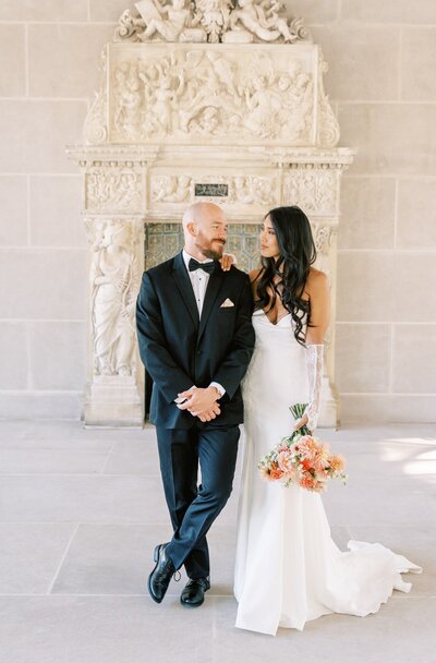 Couple sings with a guitar at a DC wedding venue. Taken by Rachel Jordan Photography