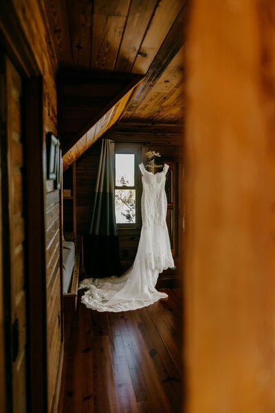 Wedding Dress hanging at Lake House at Bulow in Charleston SC 