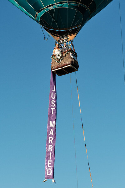 Bride and groom in a hot air balloon.