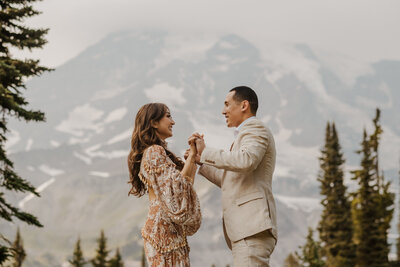 bride wearing rue de sein dress in front of mt rainier