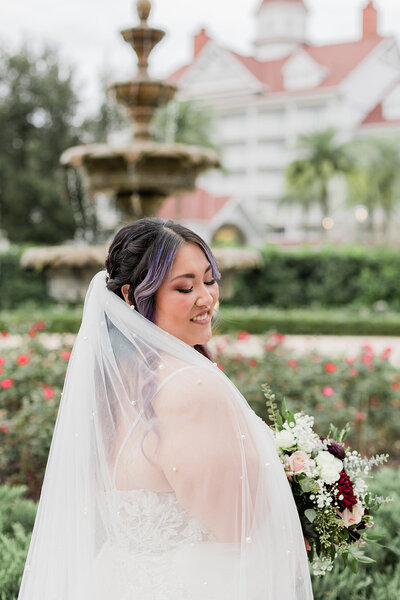Couple kissing while guests cheer at wedding