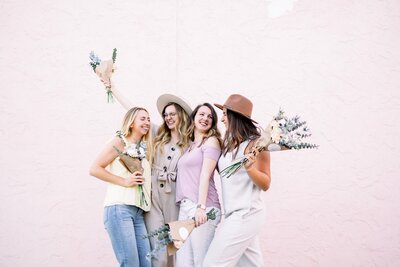 women holding bouquets