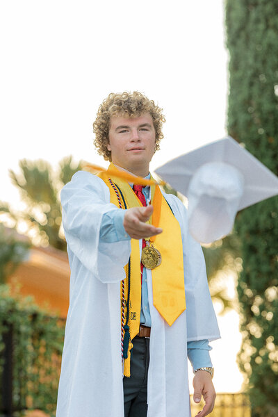 Will throws his grad cap