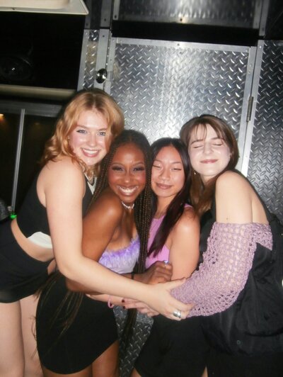Flash photo of Juma Waganda with her friends hugging each other