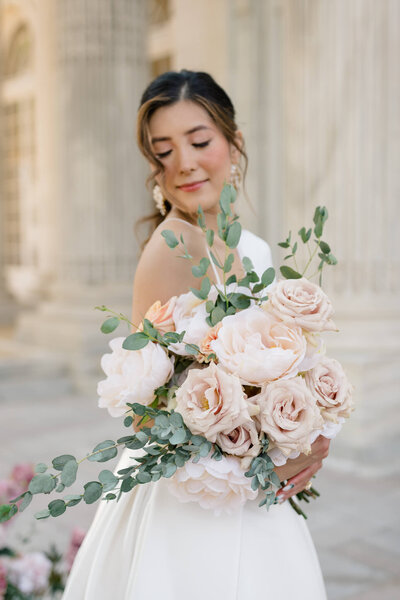 Bride and her bouquet on the portico at DAR Constitution Hall in Washington DC. Taken by Washington DC Wedding Photographer Bethany Aubre Photography.