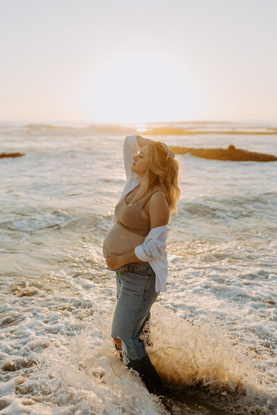 Natural Candid Documentary Family Maternity Baby Pregnancy Announcement Photo shoot at La Jolla Windansea beach at sunset - Couples Mom and Dad San Diego Maternity Photographer