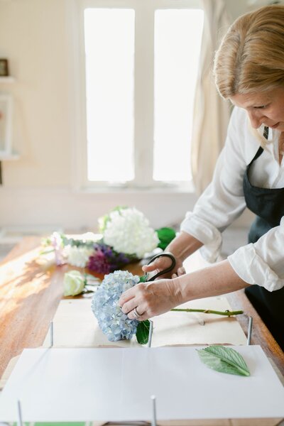 Woman pressing flowers