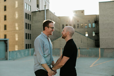 A rooftop golden hour engagement session in Winnipeg's Exchange District