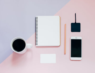 creative-flat-lay-photo-of-workspace-desk-with-blank-notebook-smartphone-card-pencil-and-hot-coffee_t20_GGBRb3 (1)