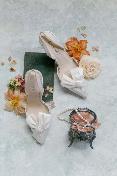 Elegant bridal shoes, pearls, and a vintage jewelry box styled for a wedding shoot in Virginia.