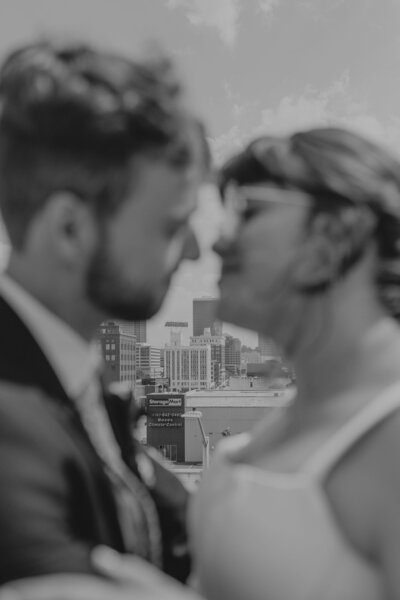 bride & groom joyfully smiling at the camera