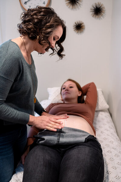 Erica Steele checks fundal height during prenatal exam at Luminary