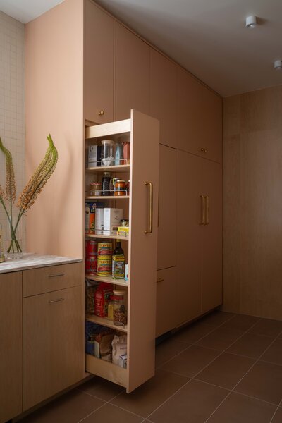 Southern California kitchen remodel galley kitchen renovation modern organic kitchen design Norwegian Rose marble countertop maple plywood kitchen cabinets stainless steel floating shelf porcelain 2x2 mosaic tile Saltillo breeze blocks modern kitchen storage solutions SoCal interior design organic modern kitchen kitchen design with natural light thoughtful floor plan edits custom pullout pantry contemporary galley kitchen