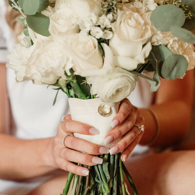wedding rings, detail shot in bridal bouquet