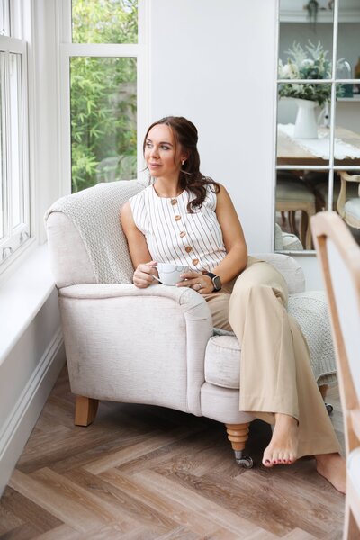 Anna sitting in a bright clinic room