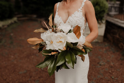 bride holding bouquet before wedding