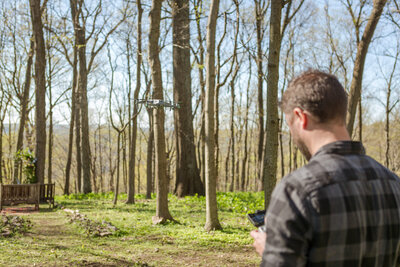Brian Johnson, Nashville wedding videographer and owner of With This Ring Wedding Films + Photo, smiling outdoors in natural light for the Meet the Creative section of the website