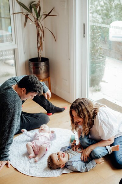 A candid family moment during a photoshoot in a beautifully restored Brunswick home in Melbourne.