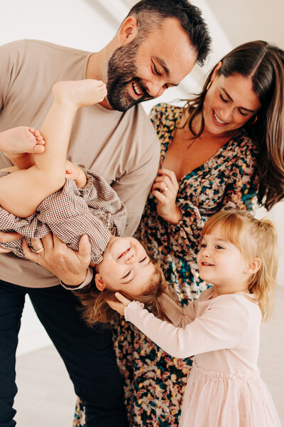 family of 3 with baby in the middle taken by a professional photographer