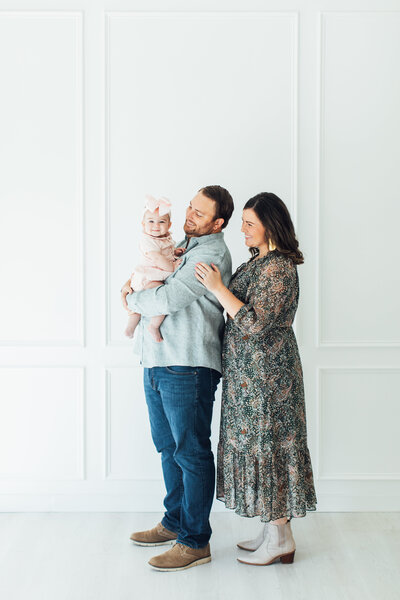 Studio Milestone Mini Session. Baby girl with mom and dad.