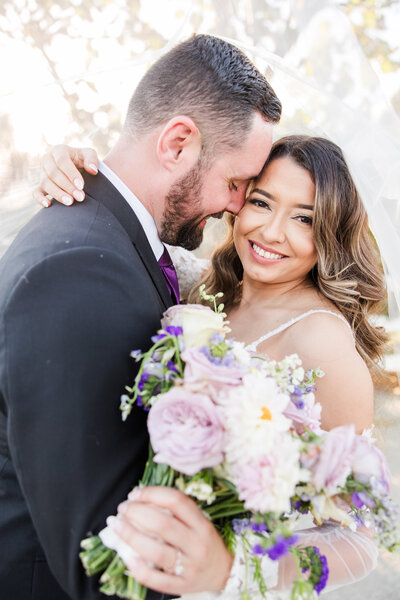 bride and groom portrait with pink bouquet