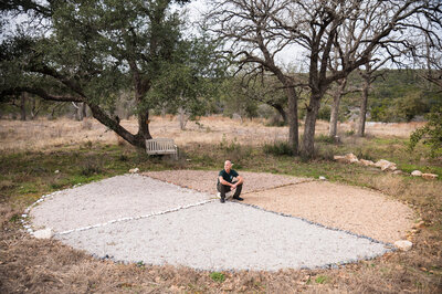 Man sitting on a concrete circle