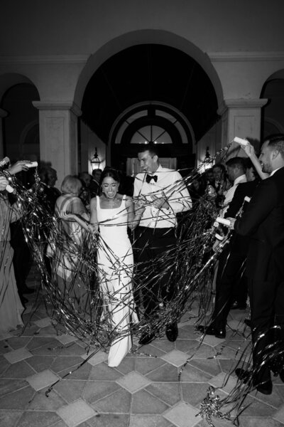 A refined wedding reception in St. Augustine, Florida—Watters & Co. Events curates a seamless guest experience with opulent tablescapes, candlelit ambiance, and lush floral arrangements.