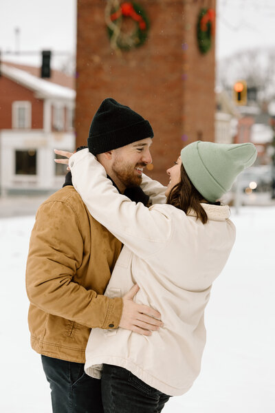 Couple embracing in the snow.