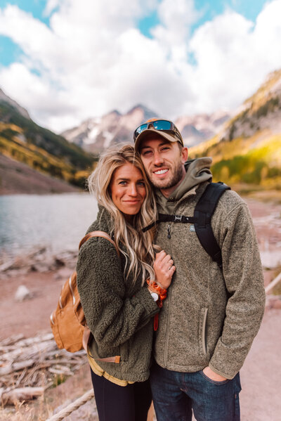 Woman and man next to mountains