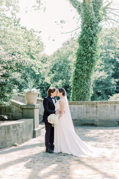 Bride and groom kissing after traditional Latin Mass wedding at Immaculate Conception in Cleveland