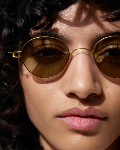Model wearing Lindberg designer sunglasses, featured by Colaizzo Opticians, a luxury eyewear boutique in Queen Anne, Seattle